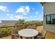 Balcony overlooks scenic ocean view and features a table and chairs, offering space for outdoor relaxation at 4365 S Atlantic Ave # B8, New Smyrna Beach, FL 32169