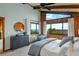 Bedroom with wooden paneled walls, ocean views, and calming decor at 4365 S Atlantic Ave # B8, New Smyrna Beach, FL 32169