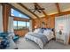 Cozy bedroom boasts ocean views and wood paneled walls for a relaxing getaway at 4365 S Atlantic Ave # B8, New Smyrna Beach, FL 32169