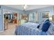 Bright bedroom with calming decor, including a view towards the kitchen and living area, creating an inviting space at 4365 S Atlantic Ave # B8, New Smyrna Beach, FL 32169