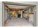 A well-organized garage with a door to the backyard and ample storage space at 4365 S Atlantic Ave # B8, New Smyrna Beach, FL 32169