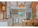 Charming kitchen features sleek, stainless steel appliances and a breakfast bar with dining area at 4365 S Atlantic Ave # B8, New Smyrna Beach, FL 32169