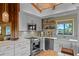 Bright kitchen with stainless steel appliances, wood accents, and white cabinets offer great appeal at 4365 S Atlantic Ave # B8, New Smyrna Beach, FL 32169