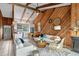 Bright and airy living space with wood paneled walls, vaulted ceilings, and an open floor plan at 4365 S Atlantic Ave # B8, New Smyrna Beach, FL 32169