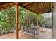 Secluded outdoor deck featuring comfortable seating and lush surroundings, complete with an outdoor shower at 4365 S Atlantic Ave # B8, New Smyrna Beach, FL 32169