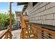 Exterior wooden staircase showcasing well-maintained cedar shake siding and lush surroundings at 4365 S Atlantic Ave # B8, New Smyrna Beach, FL 32169