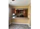 Functional kitchen with wood cabinets, laminate countertop, and essential appliances ready for personalization at 4402 King Cole Blvd, Orlando, FL 32811