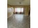 Open-concept living room featuring durable flooring, and space for dining near the kitchen bar at 4402 King Cole Blvd, Orlando, FL 32811