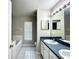 Bathroom features a double sink vanity, soaking tub and tiled floors, providing a functional and stylish space at 468 Rio Grande Ct, Kissimmee, FL 34759