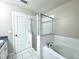 Bathroom features a soaking tub, glass shower and tiled floors, providing a functional and stylish space at 468 Rio Grande Ct, Kissimmee, FL 34759