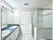Bathroom features a double sink vanity, soaking tub and tiled floors, providing a functional and stylish space at 468 Rio Grande Ct, Kissimmee, FL 34759