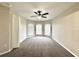 Cozy bedroom with carpet flooring, neutral walls, a ceiling fan, and bright bay windows offering ample light at 468 Rio Grande Ct, Kissimmee, FL 34759