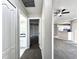 Hallway view showing the natural light, open concept, kitchen and appliances, ceiling fan, and neutral colored walls at 468 Rio Grande Ct, Kissimmee, FL 34759