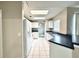 Clean kitchen featuring white cabinets and appliances, light tile floors, and a bright, airy feel at 468 Rio Grande Ct, Kissimmee, FL 34759