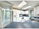 Bright kitchen features white appliances and cabinets, blue counters, and a skylight for ample natural light at 468 Rio Grande Ct, Kissimmee, FL 34759
