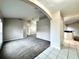 Spacious living room with carpet flooring and white tiled floors leading to bar-style kitchen area at 468 Rio Grande Ct, Kissimmee, FL 34759