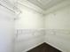 A large walk-in closet offers ample storage space with white wire shelving and neutral colored walls at 468 Rio Grande Ct, Kissimmee, FL 34759