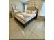 Primary bedroom boasts king bed, dresser, and decor at 4700 Prairie Point Blvd, Kissimmee, FL 34746