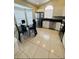 Open concept kitchen with stainless steel refrigerator and breakfast nook area at 4700 Prairie Point Blvd, Kissimmee, FL 34746