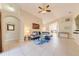 Bright living room featuring tile flooring, a ceiling fan, and neutral paint, offering a welcoming atmosphere at 4700 Prairie Point Blvd, Kissimmee, FL 34746