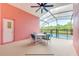 Screened patio with outdoor seating area next to a private pool with a safety fence at 4700 Prairie Point Blvd, Kissimmee, FL 34746