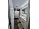 Stylish bathroom with double vanity, modern fixtures, and a well-lit mirror at 4760 Ohio Ave, Sanford, FL 32771