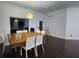 Inviting dining room with a large wooden table and modern lighting fixtures at 4760 Ohio Ave, Sanford, FL 32771