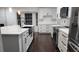 Beautiful kitchen with white cabinets, quartz countertops, and stainless steel appliances at 4760 Ohio Ave, Sanford, FL 32771