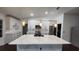 Elegant kitchen with quartz countertops, stainless appliances and modern lighting fixtures at 4760 Ohio Ave, Sanford, FL 32771