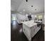 Bright open concept featuring an island kitchen overlooking living room with fireplace, stainless appliances and sleek design at 4760 Ohio Ave, Sanford, FL 32771