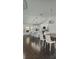 Open-concept living space with a modern kitchen, dining area, and sleek design elements at 4760 Ohio Ave, Sanford, FL 32771