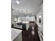 Bright, open living space featuring a stylish kitchen island, stainless appliances, and modern design elements at 4760 Ohio Ave, Sanford, FL 32771
