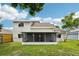 The home's exterior showcases a spacious backyard with a screened lanai, perfect for outdoor living at 478 Chicago Woods Cir, Orlando, FL 32824