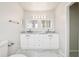 Bright bathroom featuring a double sink vanity with granite countertops at 478 Chicago Woods Cir, Orlando, FL 32824