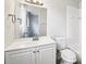 Well-lit bathroom featuring a vanity, toilet, and shower-tub combo at 478 Chicago Woods Cir, Orlando, FL 32824