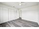 Bedroom featuring wood-look floors and a double closet at 478 Chicago Woods Cir, Orlando, FL 32824