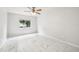 Well-lit bedroom highlighting sleek tile floors and a window, creating a modern and comfortable retreat at 478 Chicago Woods Cir, Orlando, FL 32824