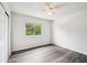 Well-lit bedroom featuring a ceiling fan and natural light at 478 Chicago Woods Cir, Orlando, FL 32824