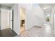 Hallway featuring tile floors, access to the stairs and a half bathroom at 478 Chicago Woods Cir, Orlando, FL 32824