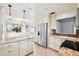 Open kitchen featuring stainless steel appliances and granite countertops at 478 Chicago Woods Cir, Orlando, FL 32824