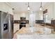 Modern kitchen featuring granite countertops, stainless steel appliances and custom cabinets at 478 Chicago Woods Cir, Orlando, FL 32824