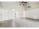 Large living room featuring tile floors, high ceilings with fans and seamless access to other rooms at 478 Chicago Woods Cir, Orlando, FL 32824