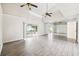 Spacious living room featuring tile floors, high ceilings, and sliding doors to the backyard at 478 Chicago Woods Cir, Orlando, FL 32824