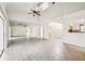 Bright living room with tile floors, high ceilings, and access to multiple areas of the house at 478 Chicago Woods Cir, Orlando, FL 32824