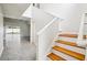 Staircase with hardwood steps and white risers at 478 Chicago Woods Cir, Orlando, FL 32824