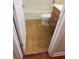 Neutral toned bathroom features a white commode, tub, and light brown flooring at 4830 S Conway Rd # 40, Orlando, FL 32812