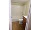 Bathroom featuring a shower-tub combo, toilet, and vanity sink with wood finish at 4830 S Conway Rd # 40, Orlando, FL 32812