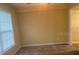 Comfortable bedroom with a window and doorway leading to a closet at 4830 S Conway Rd # 40, Orlando, FL 32812