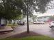 Apartment complex and parking lot with mature trees at 4830 S Conway Rd # 40, Orlando, FL 32812