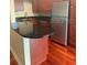The kitchen includes wooden floors and stainless steel refrigerator at 4830 S Conway Rd # 40, Orlando, FL 32812
